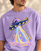 Angled close-up of the Moonbeam Club UFO print on a lavender French terry tee
