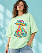 Model wearing the Tropical Transmission UFO oversized tee in jade – Fourth Dimension Club