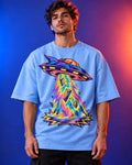 Model wearing the Arcade Anomaly UFO oversized tee in baby blue – Fourth Dimension Club