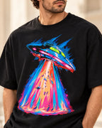 Angled close-up of the Hyperdrive Signal UFO print on a black French terry tee