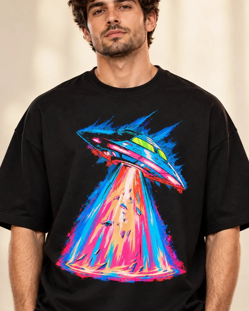 Hyperdrive Signal print close-up: sleek saucer in electric-blue speed streaks over a hot-pink beam on black French terry