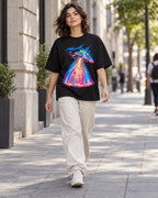 Woman walking down a city street in the Hyperdrive Signal black French terry oversized tee