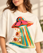 Angled close-up of the Cosmic Garden UFO print on an off-white French terry tee