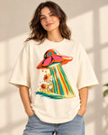 Model wearing the Cosmic Garden UFO oversized tee in off-white – Fourth Dimension Club