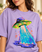 Angled close-up of the Electric Lagoon UFO print on a lavender French terry tee