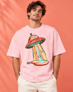 Model wearing the Candy Orbit UFO oversized tee in light baby pink – Fourth Dimension Club