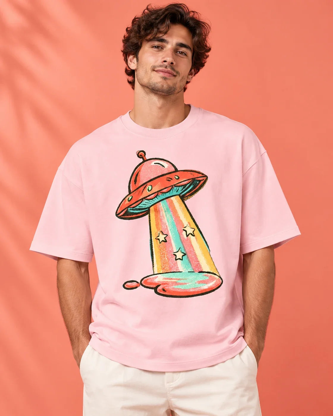 Model wearing the Candy Orbit UFO oversized tee in light baby pink – Fourth Dimension Club