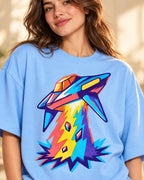Angled close-up of the Prism Strike UFO print on a baby blue French terry tee