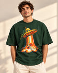 Model wearing the Solar Petals UFO oversized tee in bottle green – Fourth Dimension Club