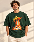 Model wearing the Solar Petals UFO oversized tee in bottle green – Fourth Dimension Club
