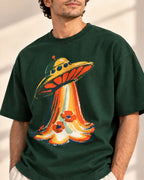 Angled close-up of the Solar Petals UFO print on a bottle green French terry tee