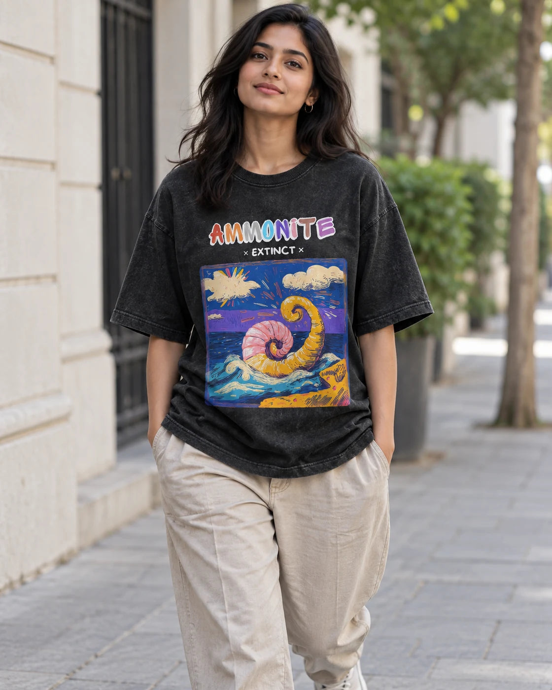 Model wearing the Ammonite black acid wash oversized T-shirt on a city street, Fourth Dimension Club
