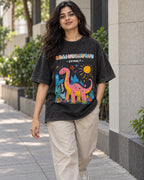 Model wearing the Brachiosaurus black acid wash oversized T-shirt on a city street, Fourth Dimension Club