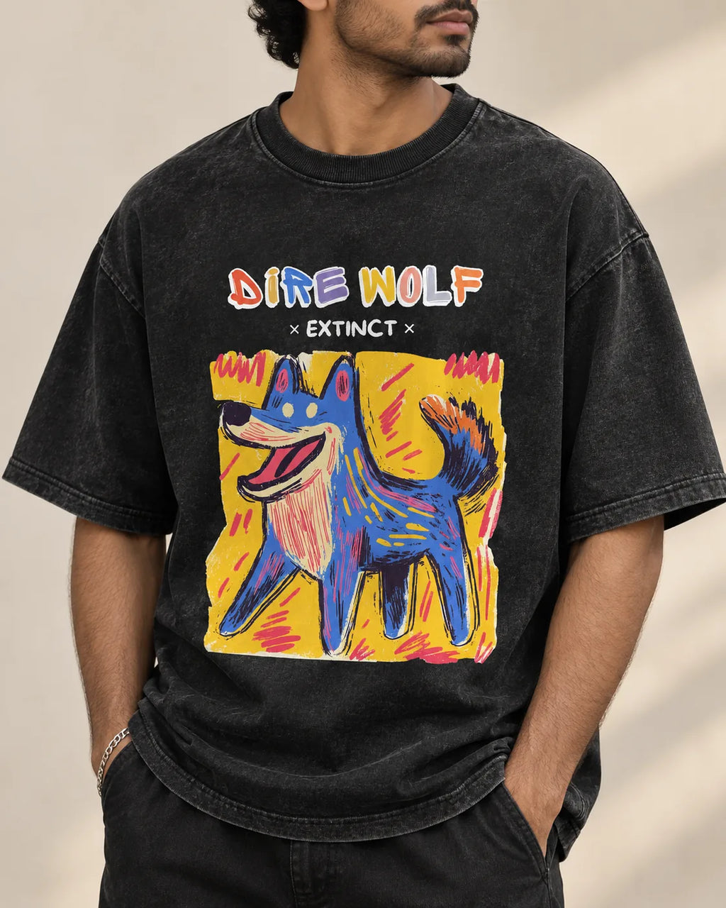 Close-up of the Dire Wolf Ancient Archives print on a black acid wash oversized T-shirt