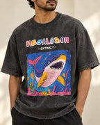 Close-up of the Megalodon Ancient Archives print on a black acid wash oversized T-shirt