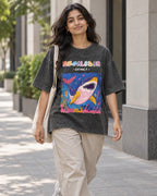 Model wearing the Megalodon black acid wash oversized T-shirt on a city street, Fourth Dimension Club