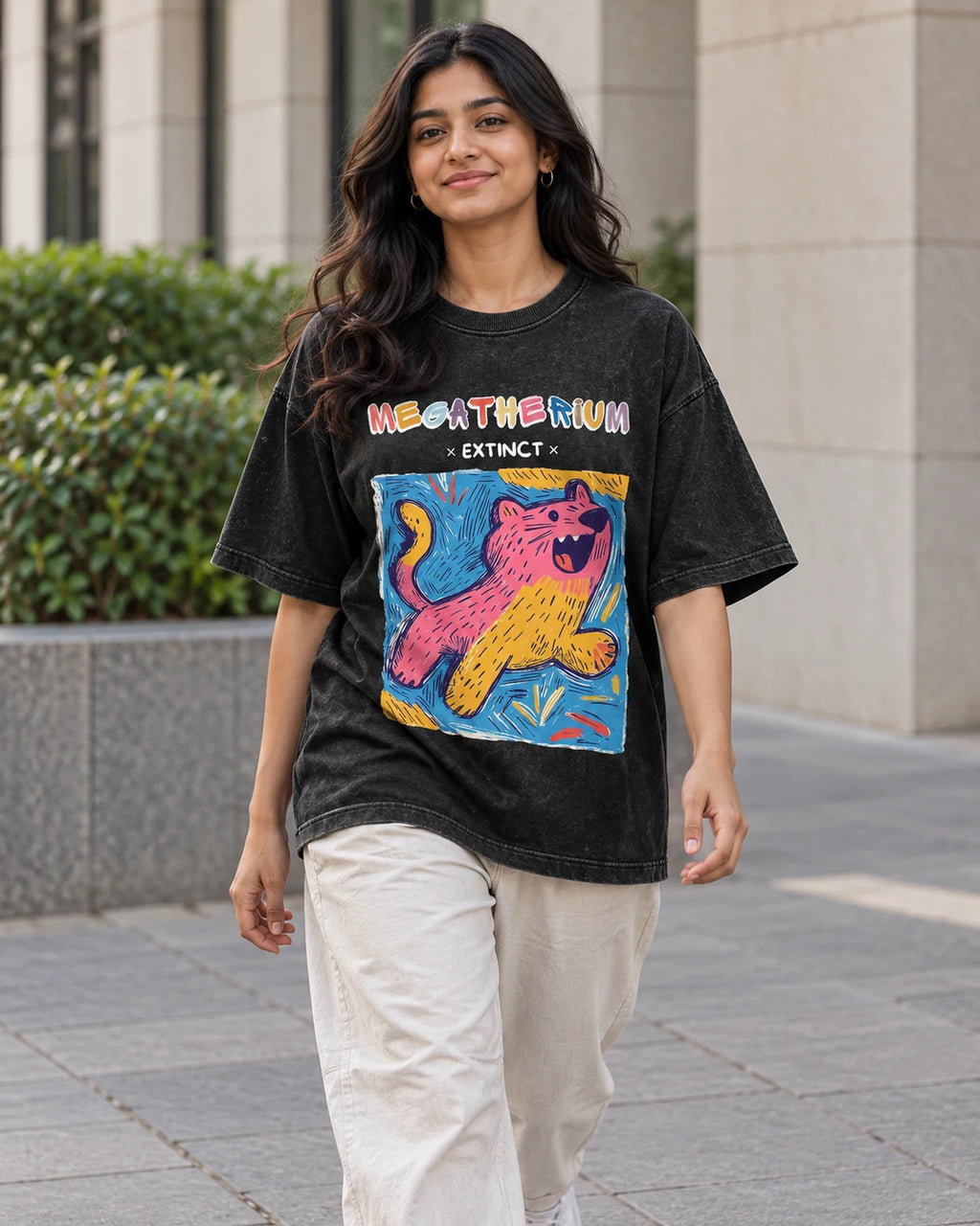 Model wearing the Megatherium black acid wash oversized T-shirt on a city street, Fourth Dimension Club