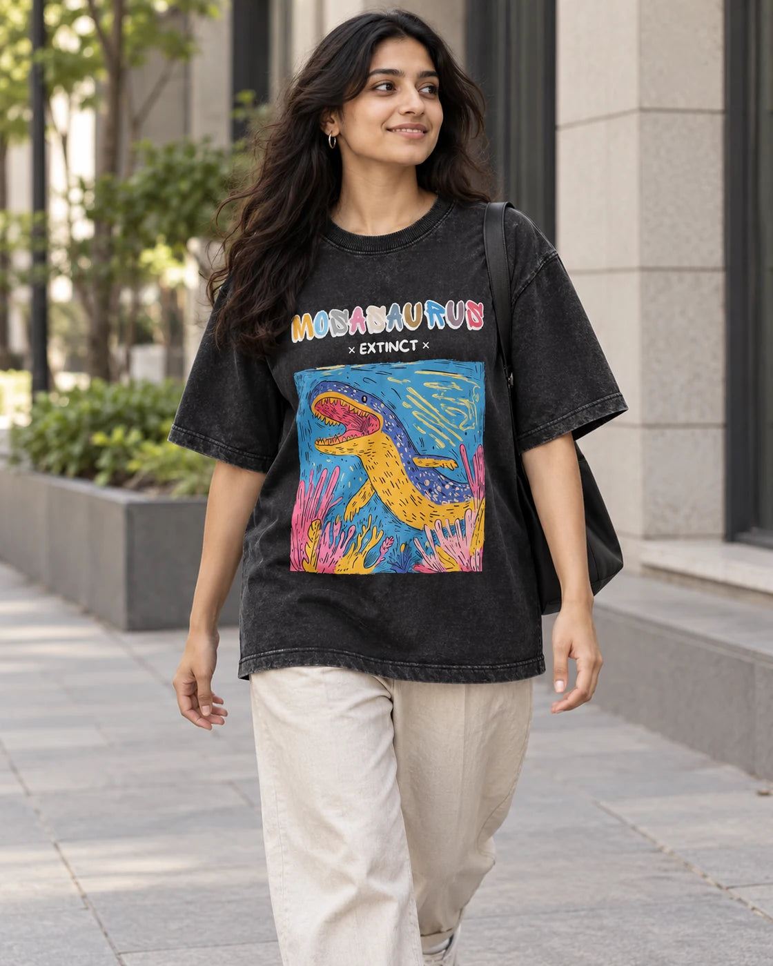 Model wearing the Mosasaurus black acid wash oversized T-shirt on a city street, Fourth Dimension Club