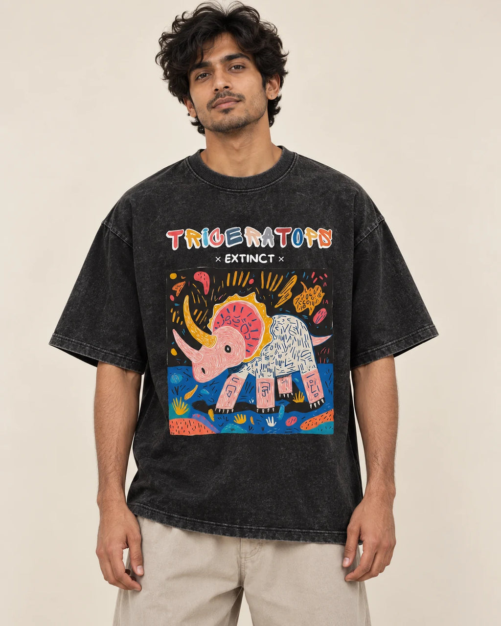 Triceratops black acid wash oversized T-shirt from the Ancient Archives collection by Fourth Dimension Club, front view on model