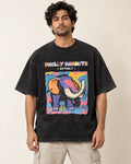 Woolly Mammoth black acid wash oversized T-shirt from the Ancient Archives collection by Fourth Dimension Club, front view on model