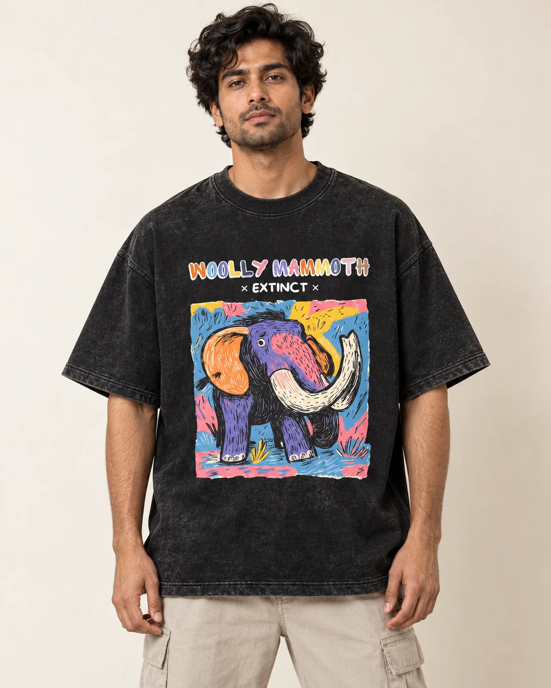 Woolly Mammoth black acid wash oversized T-shirt from the Ancient Archives collection by Fourth Dimension Club, front view on model
