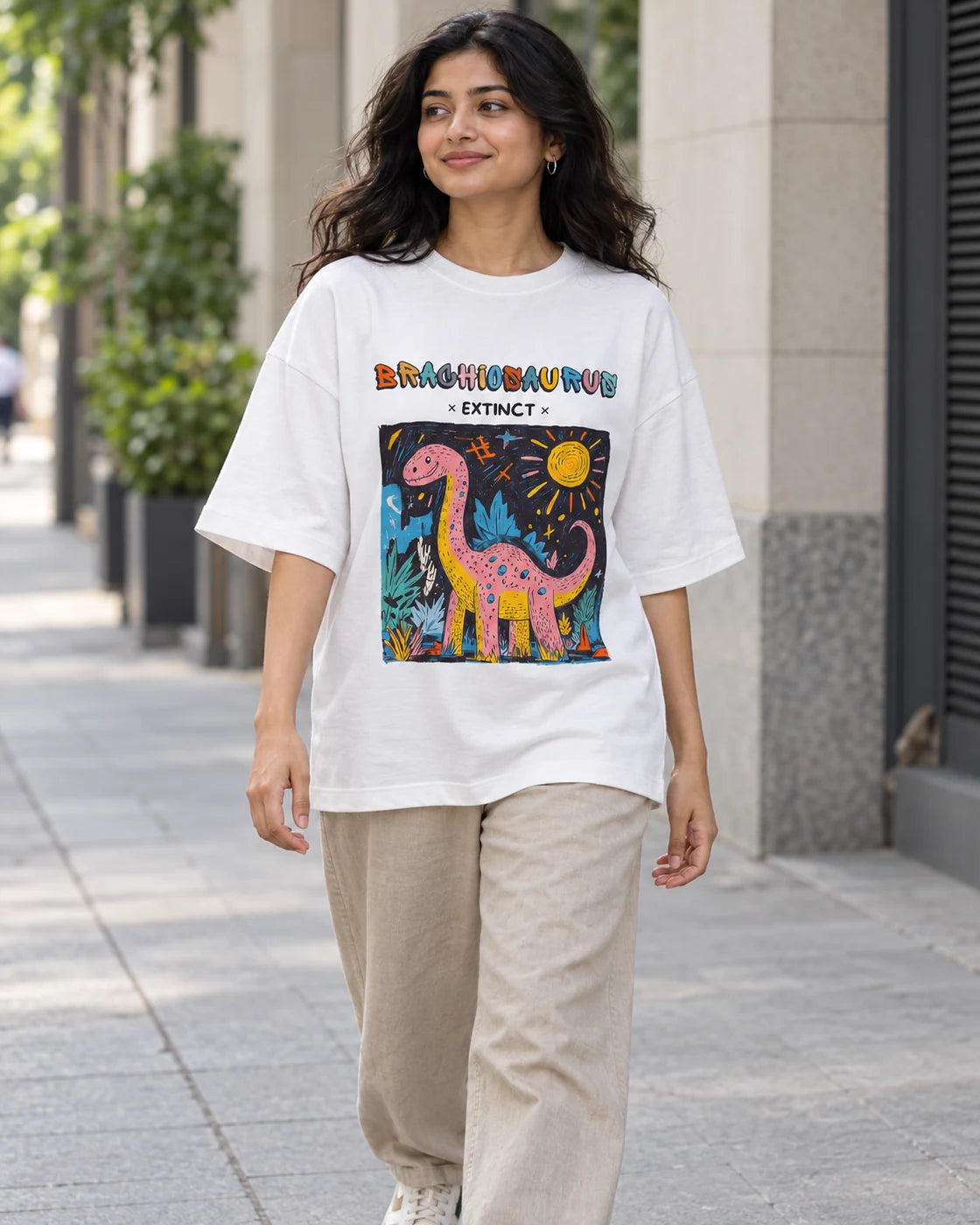 Model wearing the Brachiosaurus white oversized French terry T-shirt on a city street, Fourth Dimension Club