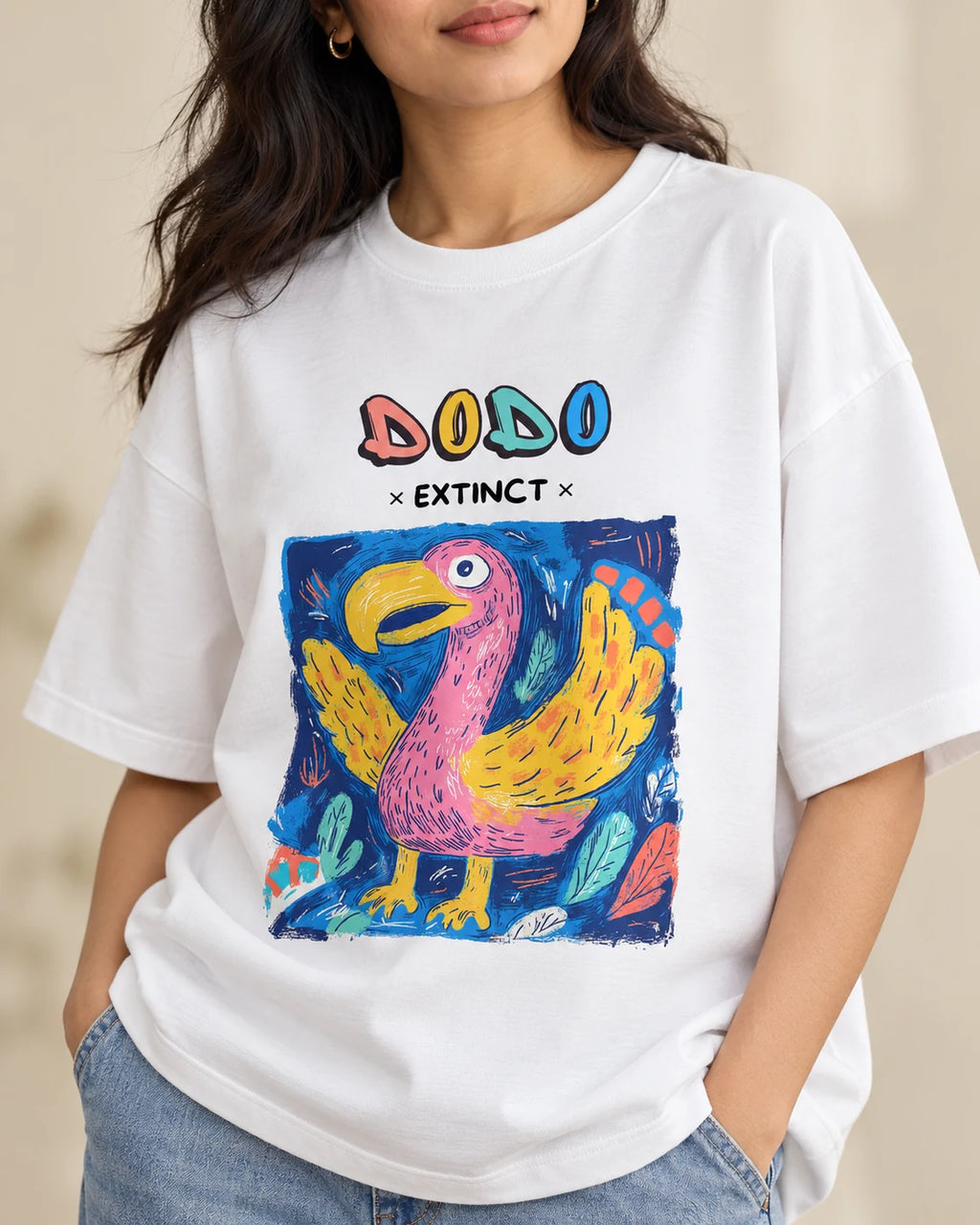 Close-up of the Dodo Ancient Archives print on a white oversized French terry T-shirt
