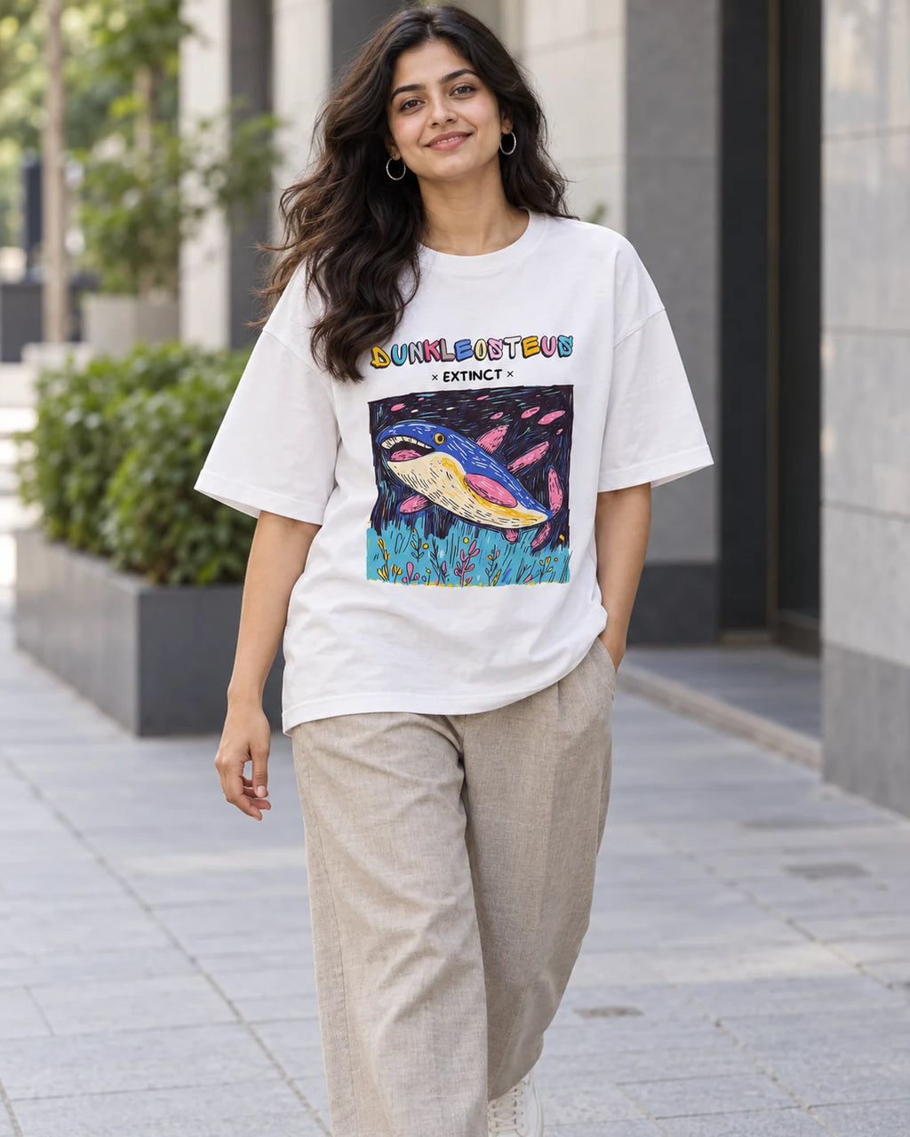 Model wearing the Dunkleosteus white oversized French terry T-shirt on a city street, Fourth Dimension Club