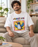 Model wearing the Great Auk white oversized French terry T-shirt seated on a sofa, Fourth Dimension Club