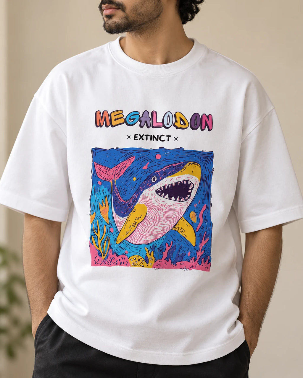 Close-up of the Megalodon Ancient Archives print on a white oversized French terry T-shirt
