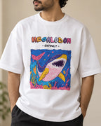 Close-up of the Megalodon Ancient Archives print on a white oversized French terry T-shirt
