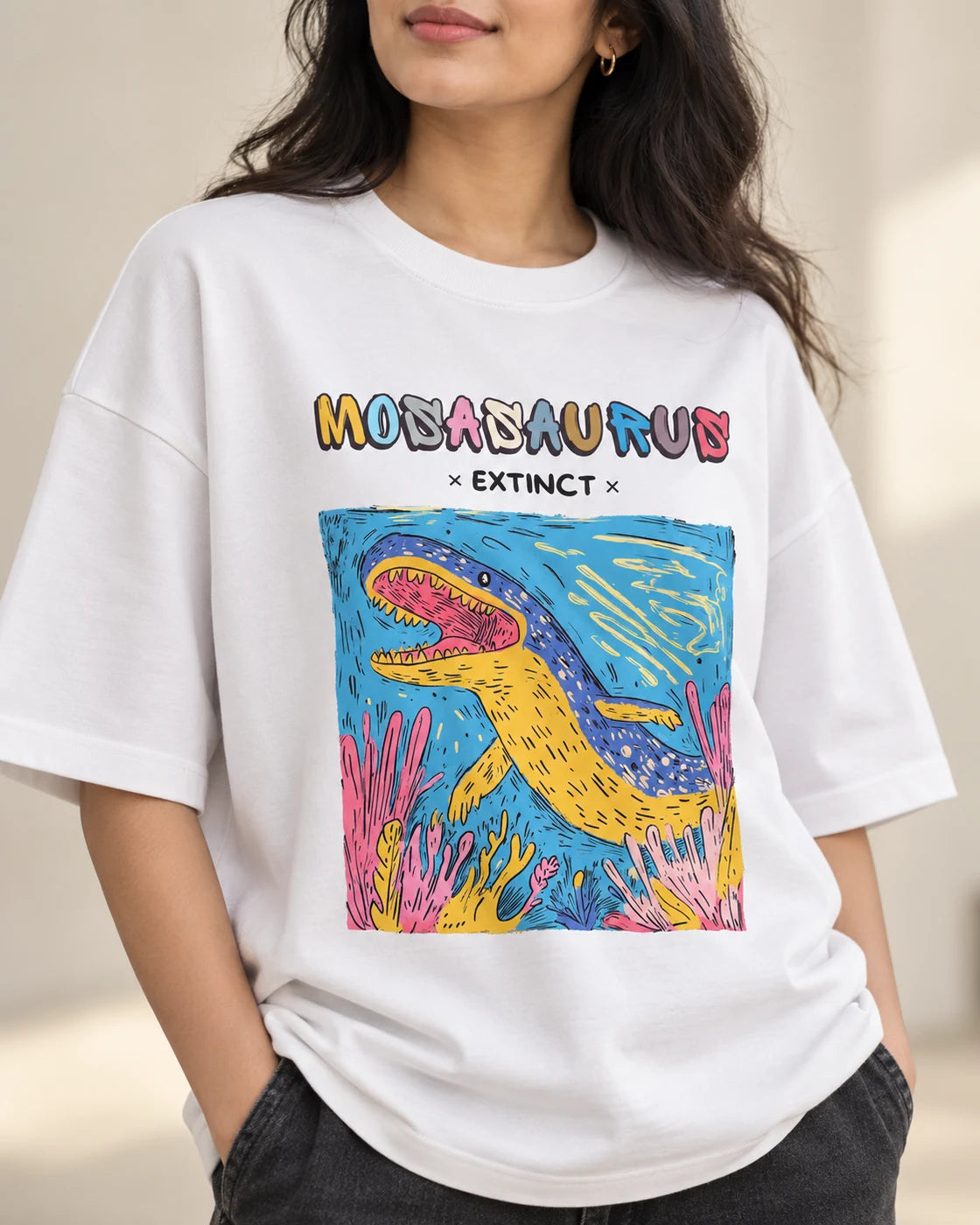 Close-up of the Mosasaurus Ancient Archives print on a white oversized French terry T-shirt