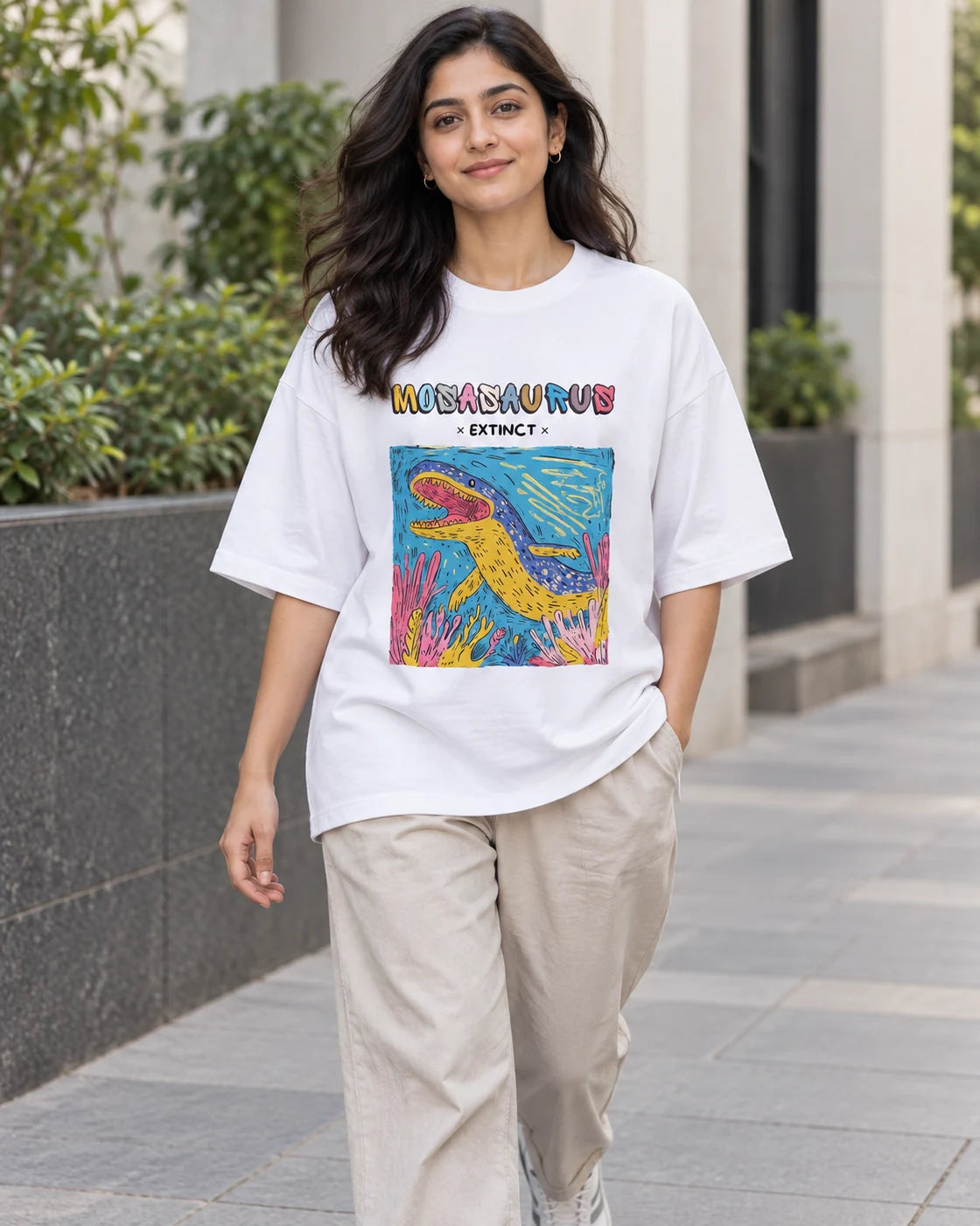 Model wearing the Mosasaurus white oversized French terry T-shirt on a city street, Fourth Dimension Club