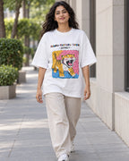 Model wearing the Saber-toothed Tiger white oversized French terry T-shirt on a city street, Fourth Dimension Club