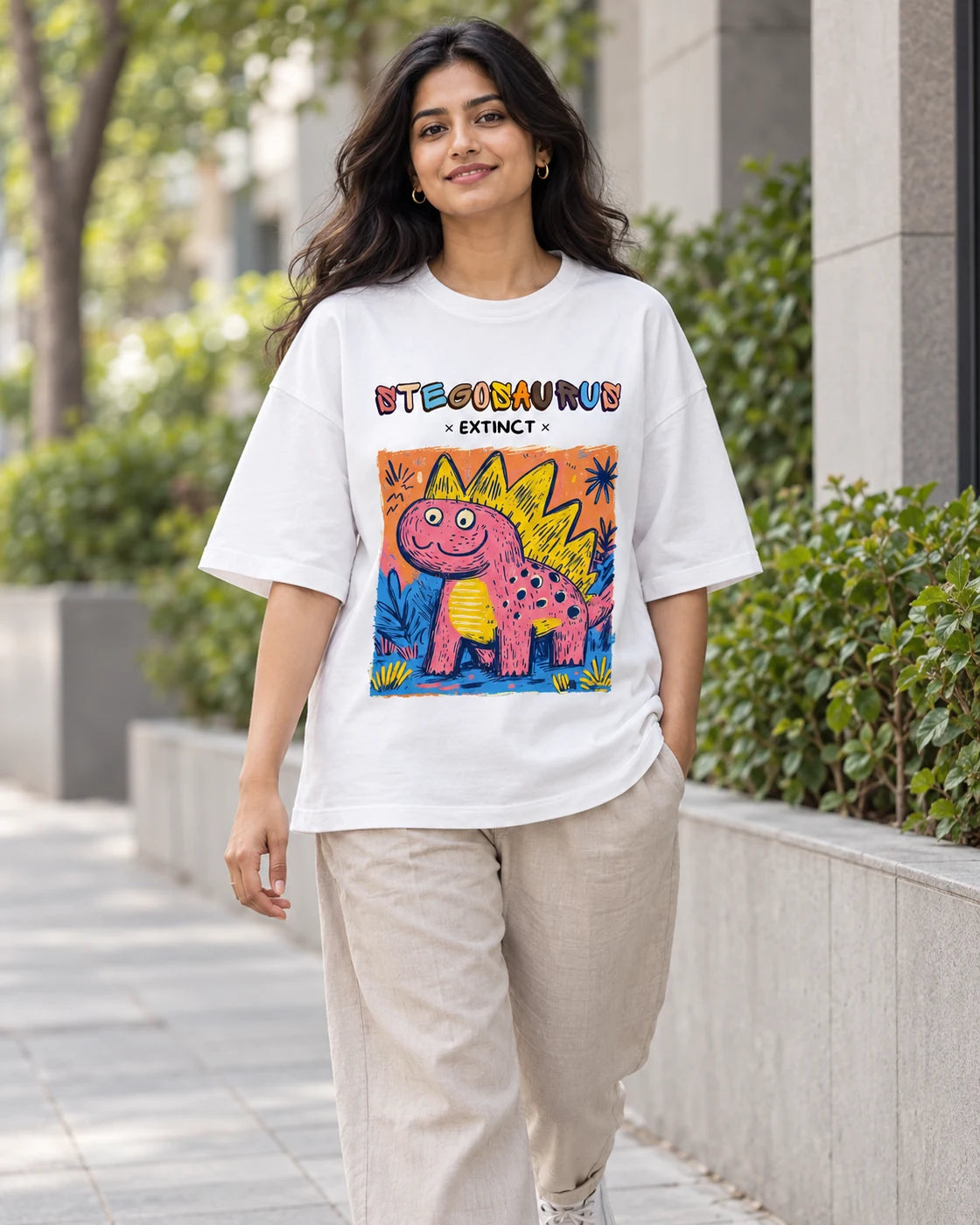 Model wearing the Stegosaurus white oversized French terry T-shirt on a city street, Fourth Dimension Club