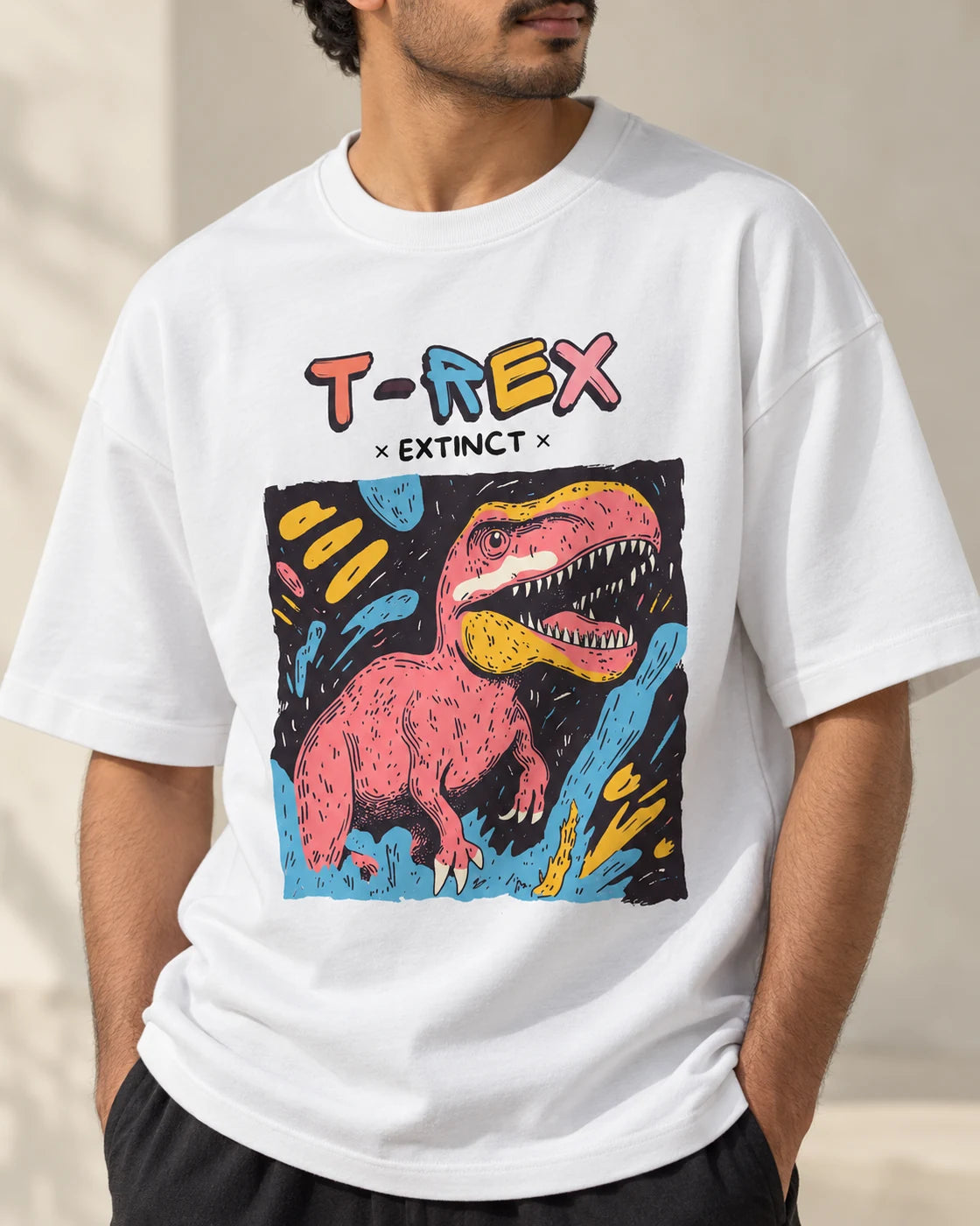 Close-up of the T-Rex Ancient Archives print on a white oversized French terry T-shirt
