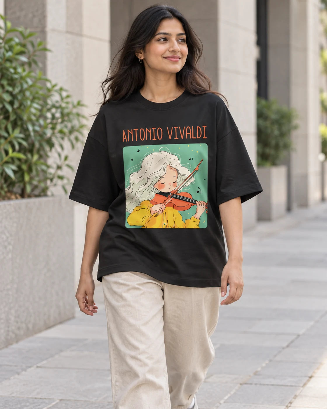 Model wearing the Antonio Vivaldi Genius Doodles oversized French terry T-shirt by Fourth Dimension Club on a city street