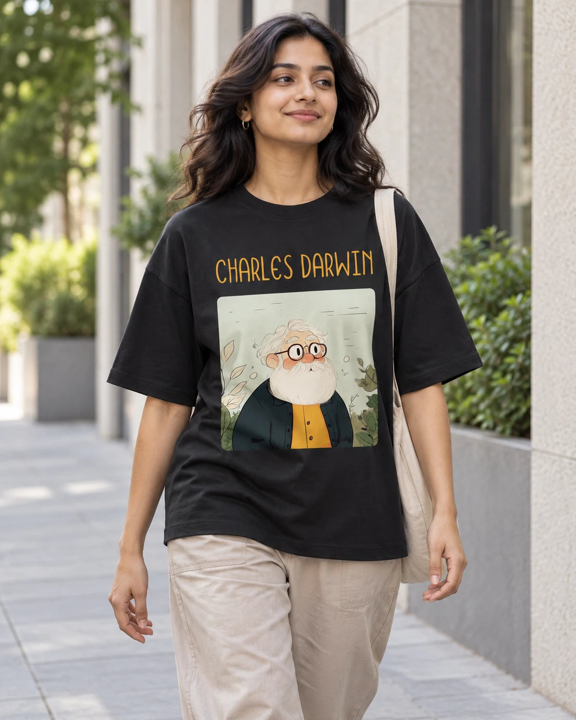 Model wearing the Charles Darwin Genius Doodles oversized French terry T-shirt by Fourth Dimension Club on a city street
