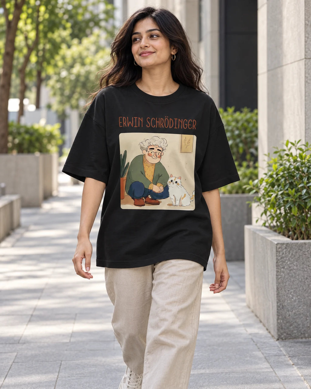 Model wearing the Erwin Schrödinger Genius Doodles oversized French terry T-shirt by Fourth Dimension Club on a city street