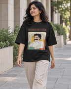 Model wearing the Friedrich Nietzsche Genius Doodles oversized French terry T-shirt by Fourth Dimension Club on a city street