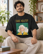 Model wearing the Isaac Newton Genius Doodles oversized French terry T-shirt by Fourth Dimension Club, seated on a sofa