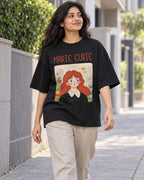 Model wearing the Marie Curie Genius Doodles oversized French terry T-shirt by Fourth Dimension Club on a city street