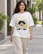 Model wearing the Nikola Tesla Genius Doodles oversized French terry T-shirt by Fourth Dimension Club on a city street