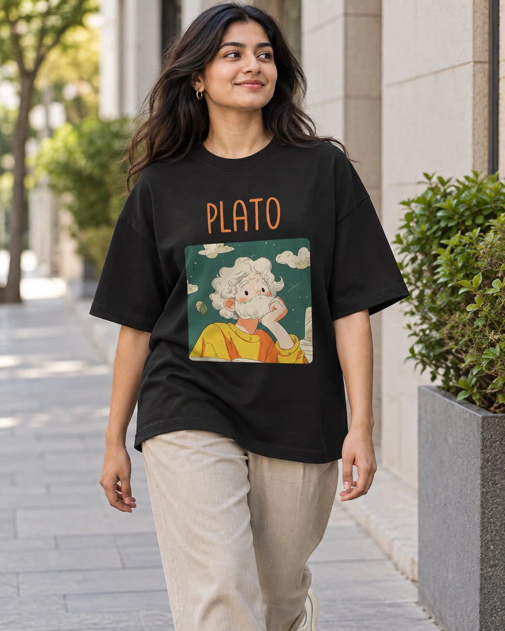 Model wearing the Plato Genius Doodles oversized French terry T-shirt by Fourth Dimension Club on a city street