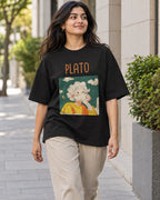 Model wearing the Plato Genius Doodles oversized French terry T-shirt by Fourth Dimension Club on a city street