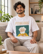 Model wearing the Pythagoras Genius Doodles oversized French terry T-shirt by Fourth Dimension Club, seated on a sofa