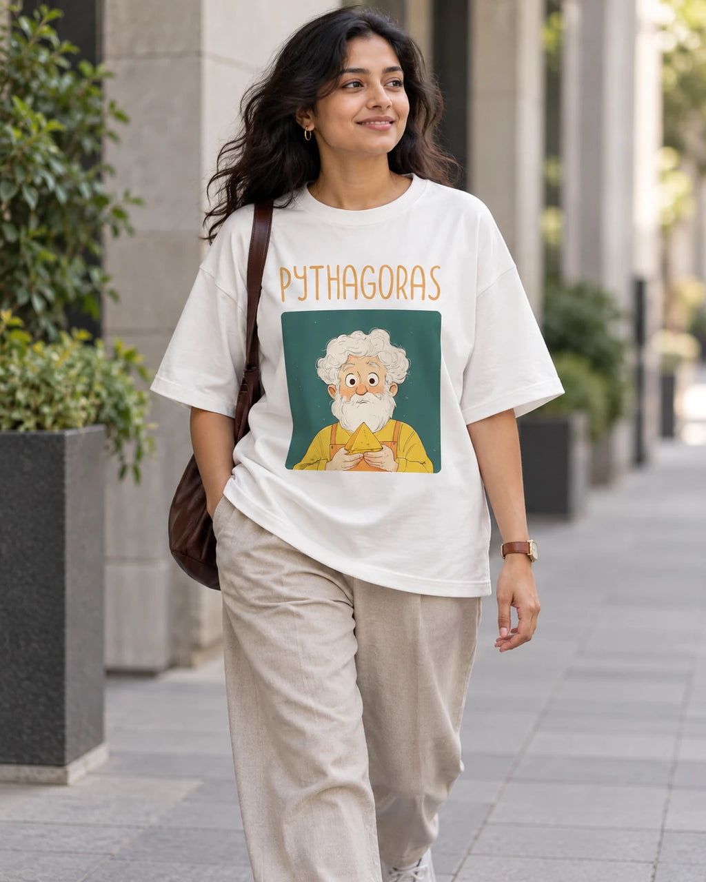 Model wearing the Pythagoras Genius Doodles oversized French terry T-shirt by Fourth Dimension Club on a city street