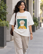 Model wearing the Pythagoras Genius Doodles oversized French terry T-shirt by Fourth Dimension Club on a city street