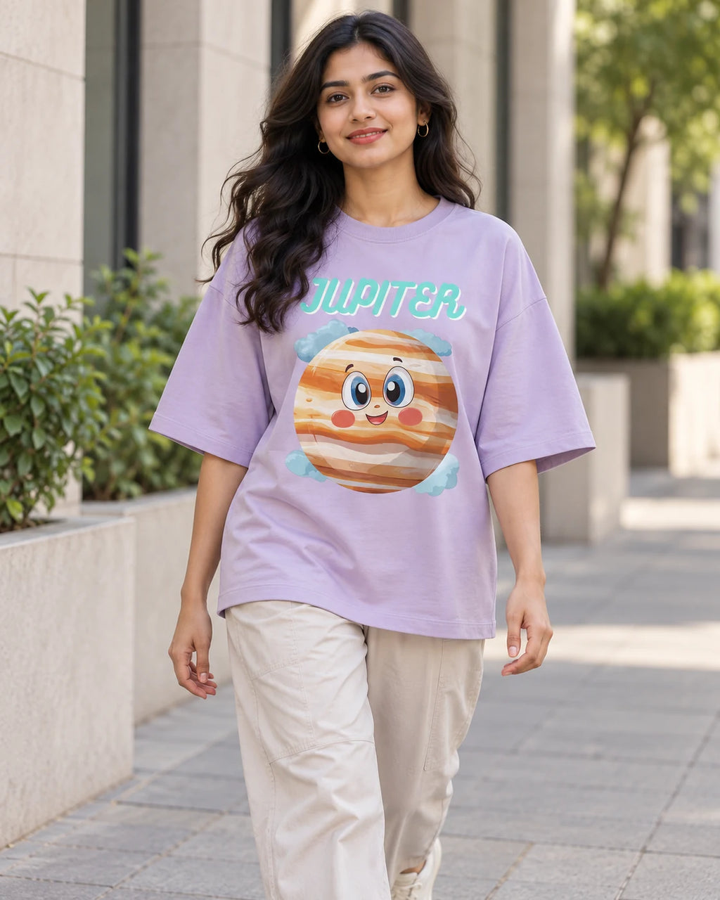 Model wearing the Jupiter Stellar Squad oversized French terry T-shirt in lavender by Fourth Dimension Club on a city street