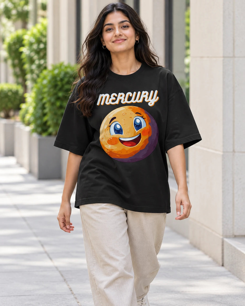 Model wearing the Mercury Stellar Squad oversized French terry T-shirt in black by Fourth Dimension Club on a city street